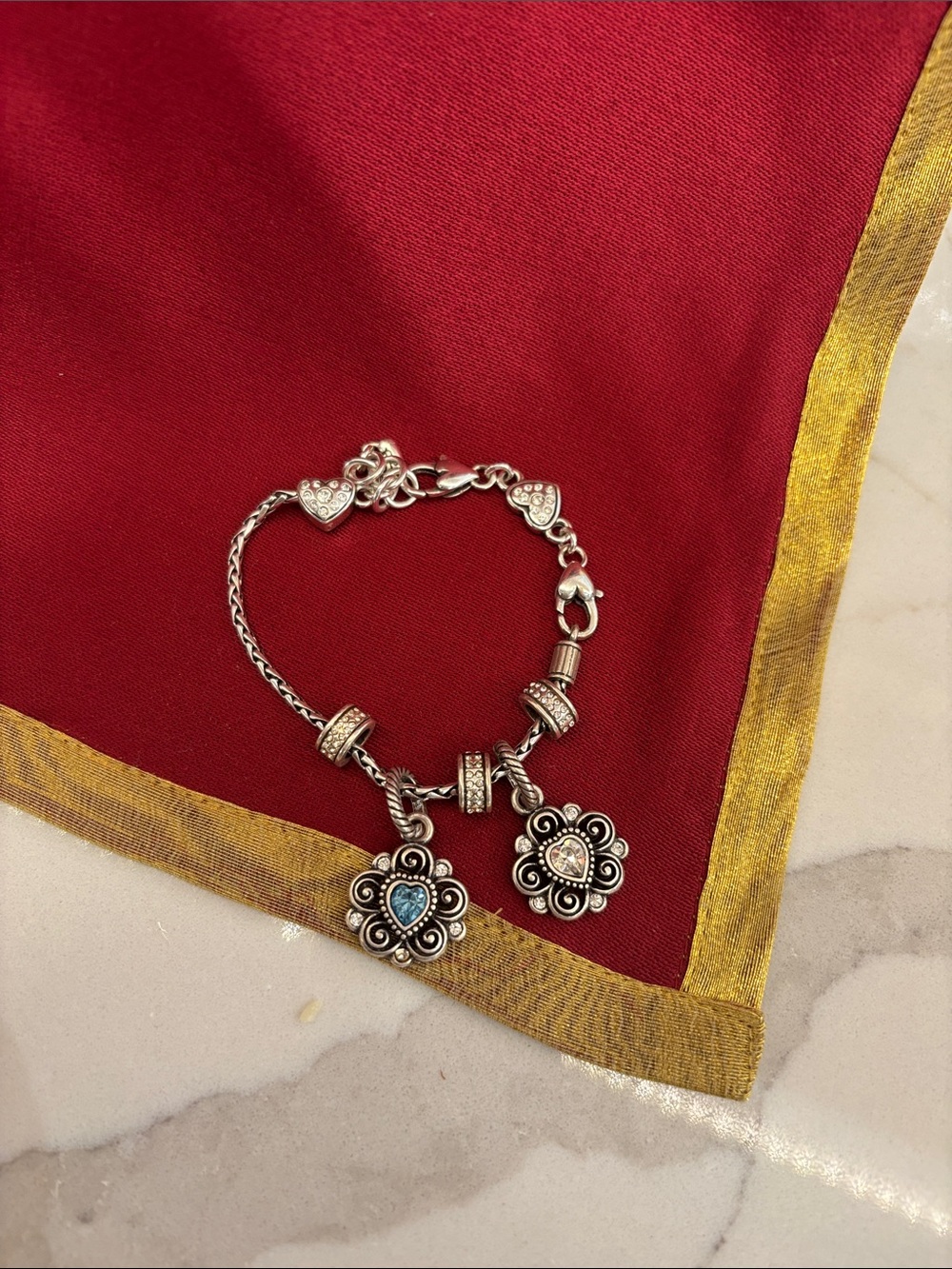 Brighton Beverly Glam charm bracelet with 2 heart flower sliders.  Silver plated